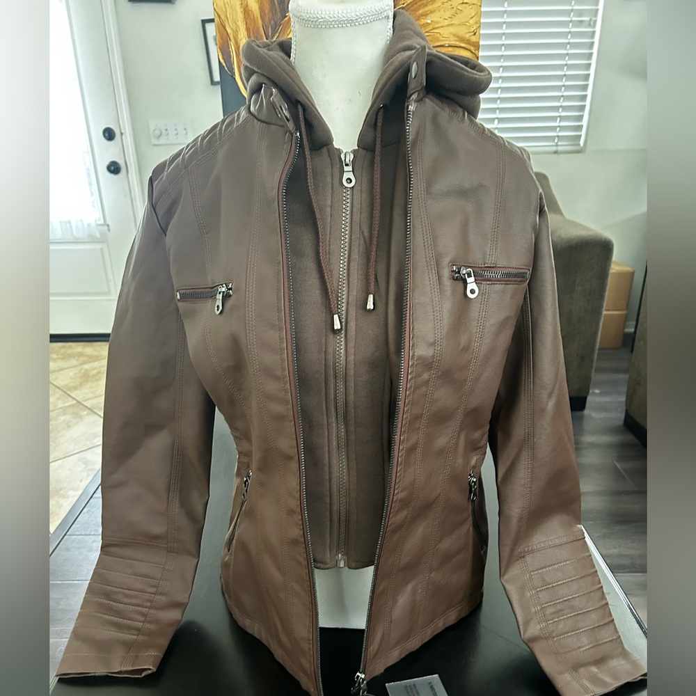 Jacket Fabric 65% Polyurethane 35% Polyester and Lining is 100% Polyester
